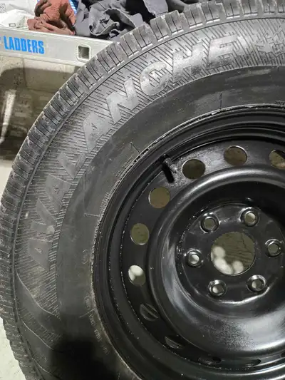 Brand new winter rim and 50 to 60 percent tire tread left great spare and balanced for chevy pick up...