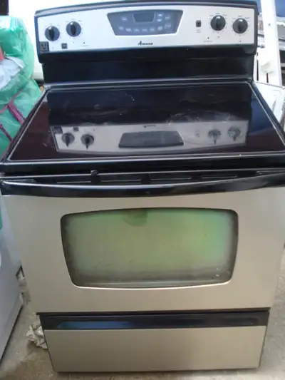 Selling great working electric stove- glass top, stainless steel on black, clean, tested by applianc...