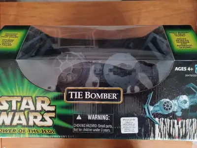 Tie Bomber Starwars starship with pilot 2001 MIB Never been opened. The packaging is in excellent co...