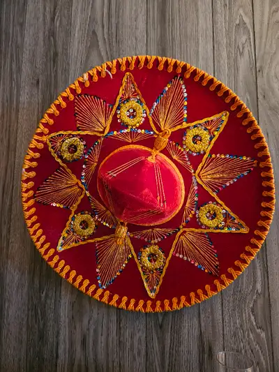 Sombrero brought home from Mexico. Approx. 24" - 30" diameter. $20. No delivery.