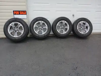 Four 18 inch Jeep Wrangler wheels with GoodYear Wrangler tires, 255 /70 R18. Wheels are like new ,on...