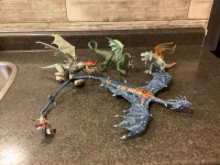 FOUR TOY DRAGONS