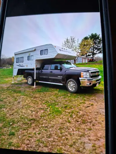Truck camper fully equipped. Fits 3/4 ton 6.5 ft truck with tailgate down. Has AC , toilet and showe...