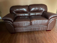 Chocolate leather love seat!! Asking $350
