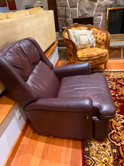 Recliner Dark brown/ burgundy. Genuine Leather. Super comfortable armchair. Good condition except se...