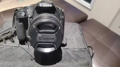Canon EOS Rebel T1i with EF-S 18 - 55 mm f3.5 - 5.6 /s len. Come with Canon strap, case and battery....