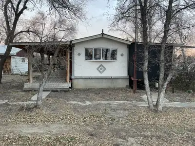 Mobile home located in Simmie,Saskatchewan Very close to Duncairn Dam. Approx 1100 square feet New f...