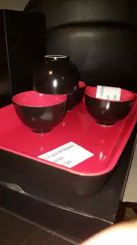 4 bowls and Baking dish in black with red interior.