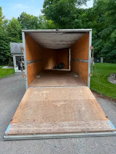 22” enclosed traile plus a 5’ V nose. Drive thru trailer with front and rear roll door.