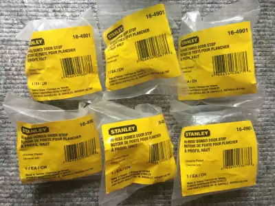Six New Stanley Hi-Rise Domed Door Stops. Chrome plated in original packets with mounting screws.