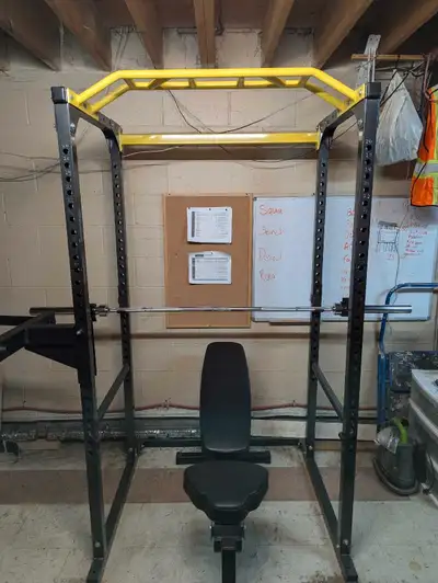 Power rack with adjustable saftey pins Removable Dip bar Adjustable bench 45lb olympic size barbell...