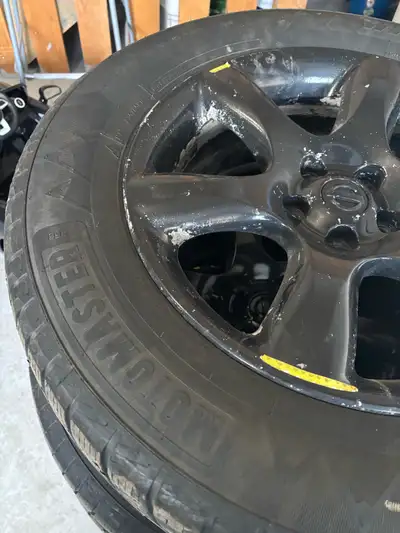 235/65/18 tires on rim (Nissan rim sprayed black). Tire is pretty much worn. Selling for $250.