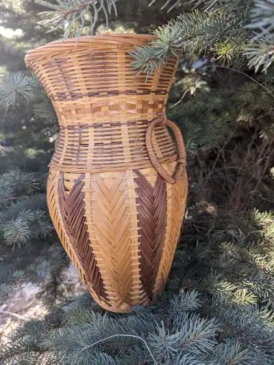 New wicker vase. It's about 2 and 1/2 ft. Tall 25 in W , View more