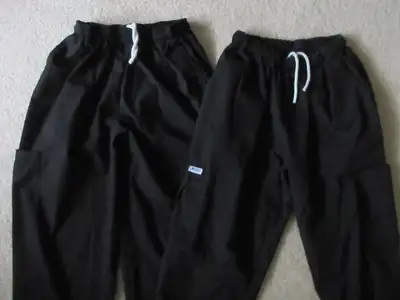 Two new black 5 pocket scrub pants ready for wearing New with Tags. Sold as a set for $40 Velcro fla...