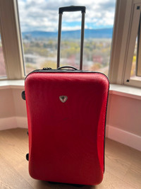 Hard side red suitcase