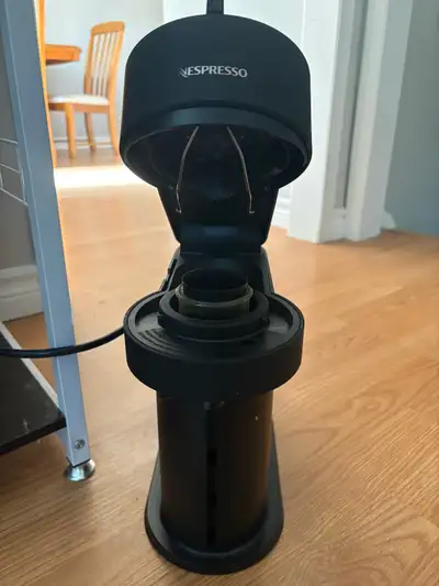 Elevate your morning routine with this pre-loved Nespresso Vertuo Next coffee and espresso machine,...