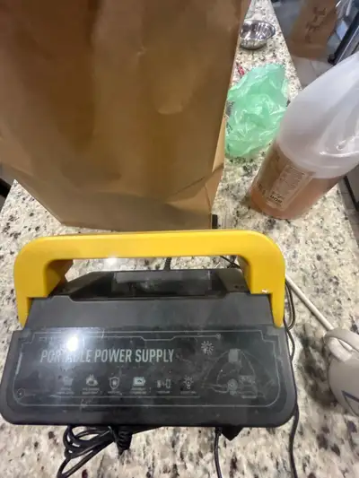 This is a Rocksolar portable power supply with various output options including USB, AC, and DC, per...