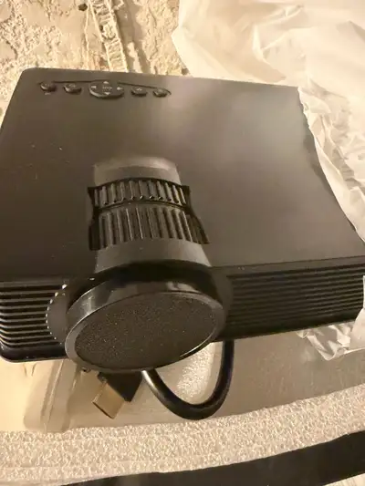 Brand New Mini Portable Home Theater Projector – In Box, View more