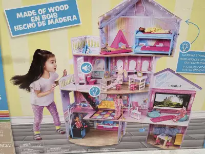 This is a new in box KidKraft Ultimate Slumber Party Mansion Dollhouse, a wooden dollhouse almost 5...