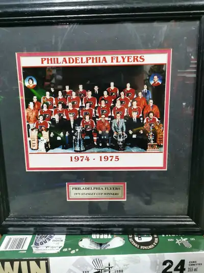 Own a piece of hockey history with this framed Philadelphia Flyers 1974-1975 Stanley Cup Winners tea...