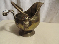 Small brass coal scuttle with ceramic handle.
