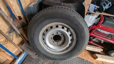 Four Bridgestone Blizzak snow tires on steel rims for F250/F350 Superduty pickup truck. Used two sea...