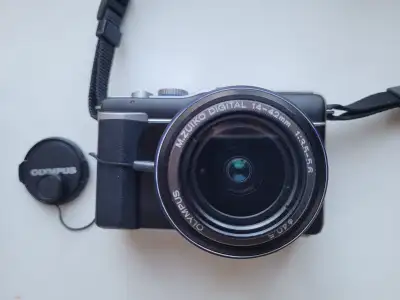 Olympus E-PL1 Micro 4/3 Digital Camera. Micro Four Thirds mirrorless camera with less than 2,300 shu...