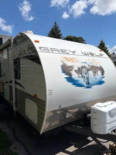 31 ft grey wolf clean and spacious large power slide Comes with bunks at the rear Private master bed...