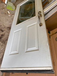 34 inch used metal door with frame.