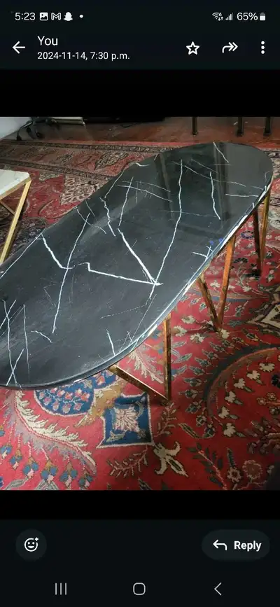 White Marble Coffee Table - $250 Square white marble-top coffee table with gray veining and gold geo...