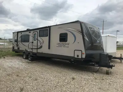 The 2015 LACROSSE LUXURY LITE 333RKS (by Prime Time mfg.) is a spacious, double-slide travel trailer...