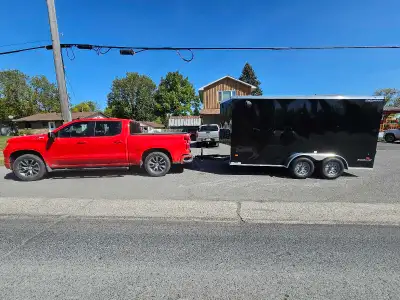 2025 HaulAbout Bobcat. 14ft tandem axle cargo trailer. Ramp door at back. Man door on side with extr...