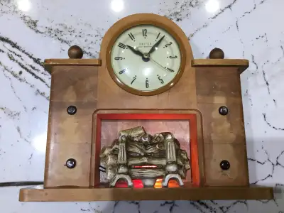 Vintage 1940’s United self starting electric wood framed ceramic fireplace Mantel clock with light....