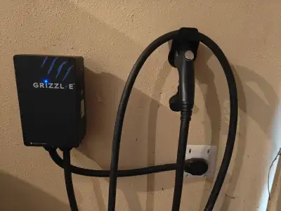 Wall mounted, requires 240-volt outlet. Lengthy cable.