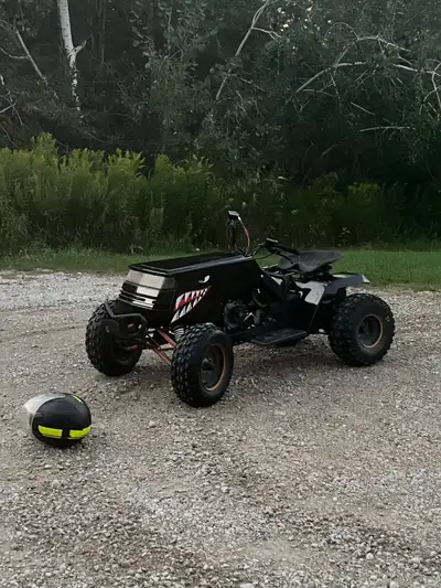 Custom black shark-mouthbuggy is ready to rip and has some serious power — it starts on the first pu...