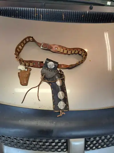 Vintage gun holster, little toy gun included $40