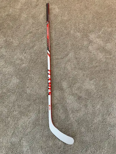 Flames Michael Frolik #67 signed commerative hockey stick. Never used. Stored indoors in a smoke fre...
