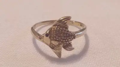 A BEAUTIFUL POSSIBILY MADE BY ORDER FISH MADE OF 10KT GOLD RING SIZE IS 7.75 IT WEIGHS 2.15GM. IT IS...
