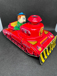 1950 ko made in Japan. Tin toy. Antique tank plow with driver