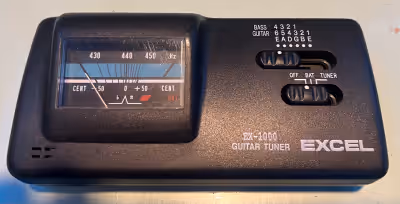 Excel EX-1000 quartz Guitar Tuner for sale. Works great! Just not using anymore. Battery not include...