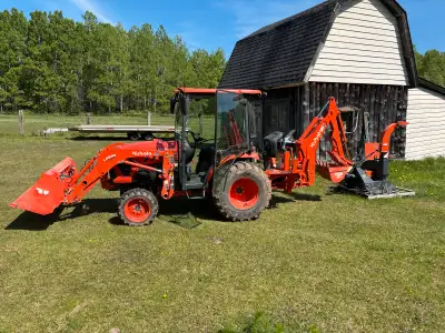 Kabota Mid Size tractor with Backhoe for Rent . Wood chipper and pallet forks also available. $225 p...