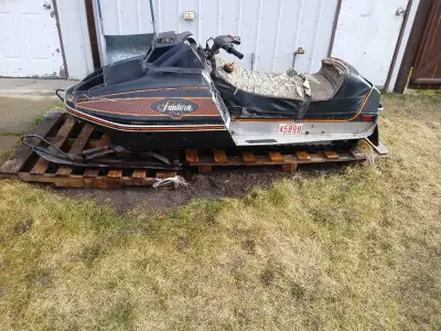 It runs. Last taken out 3 years ago. Pull start. Track in good shape. Needs the seat recovered , and...