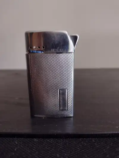 VINTAGE CIGARETTE LIGHTERS There are three (3) vintage lighters in this package and are as follows:...