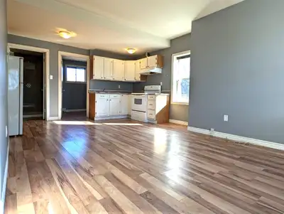 In a quiet building close to all amenities, parking and laundry included, rent plus utilities.