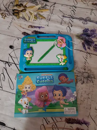 Bubble Guppies drawing adventure! This set includes a magnetic drawing board with a magnetic pen, ma...