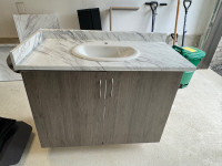 Single sink bathroom vanity with wooden countertop