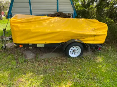 4.5' X 8' utility trailer from Home Depot includes tarp and tong jack.
