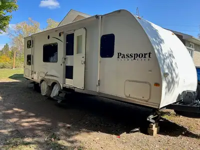 Well maintained travel trailer, 1/2 ton towable UltaLite model. - Sleeps 8, front queen walk around...