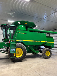 John Deere 9510 with 930F and header cart