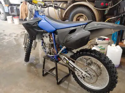 This is a 2003 Yamaha YZ450F. Drives beautiful. Haven't driven it for 3years since I bought a Cruise...